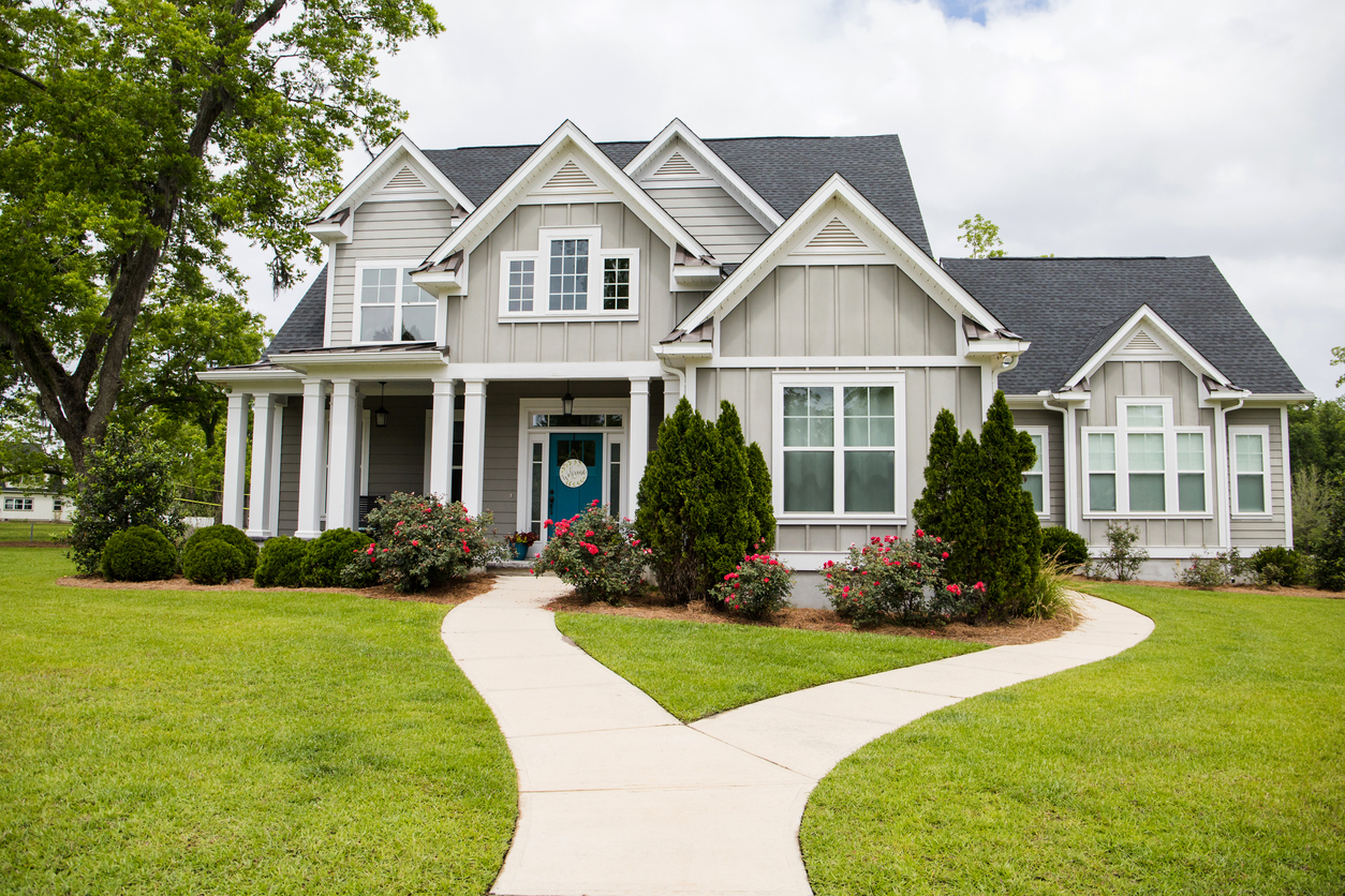 Board-and-batten two-story with a curved double walkway