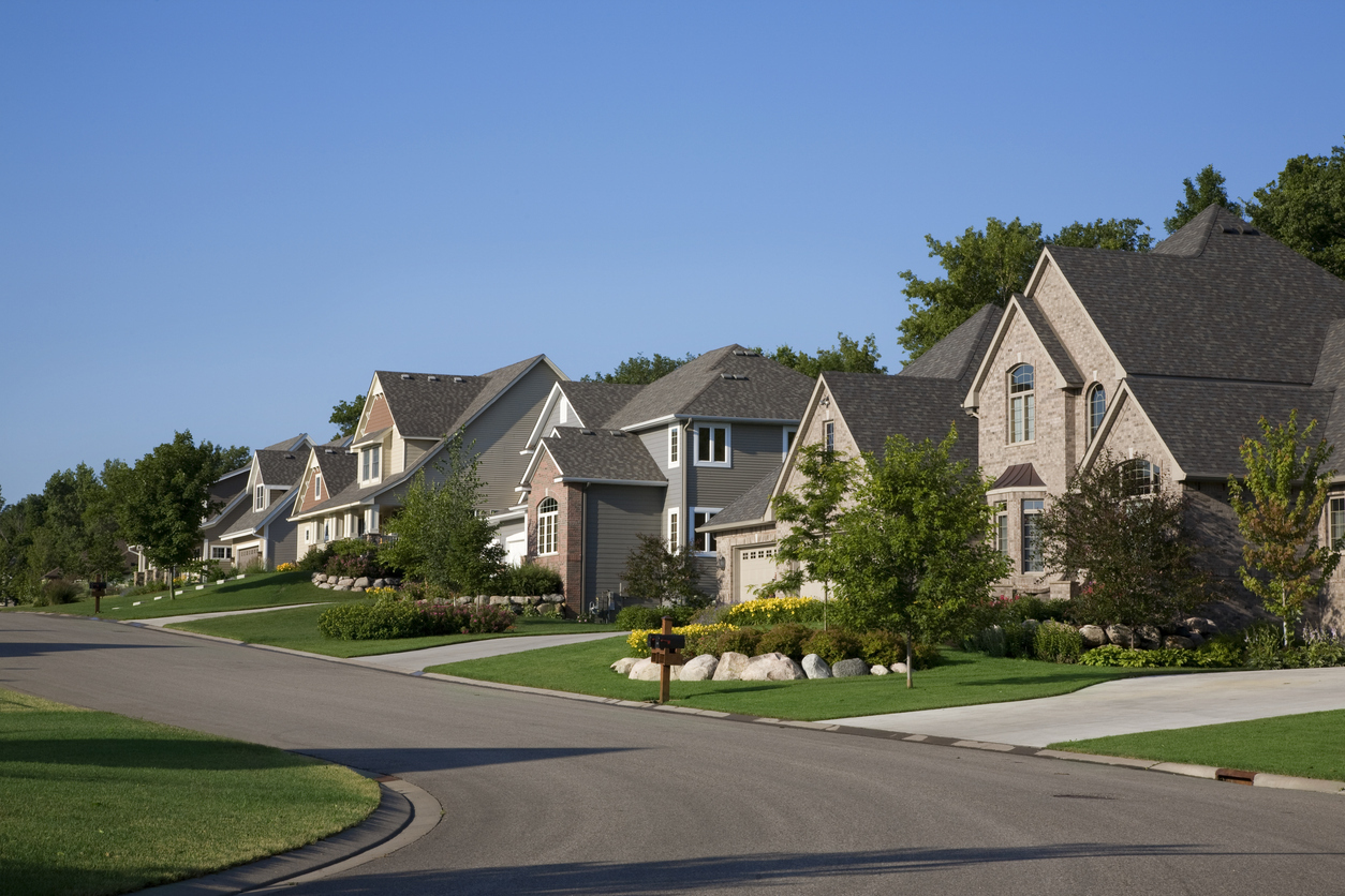 Street of newer single-family homes in a planned community