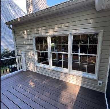 New windows on an enclosed sunroom deck, installed by Virginia Exteriors